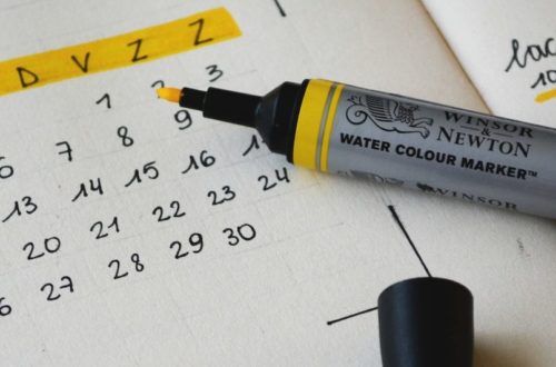 black marker on notebook